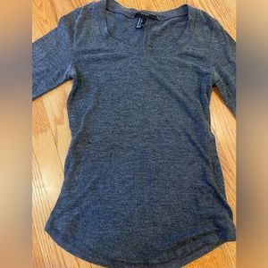 Dark grey body hugging long sleeve shirt in a size small